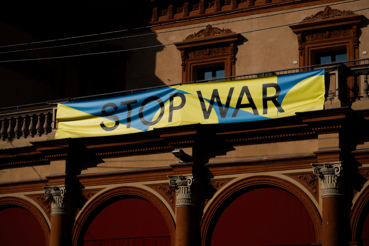 A sign that reads stop war on a building