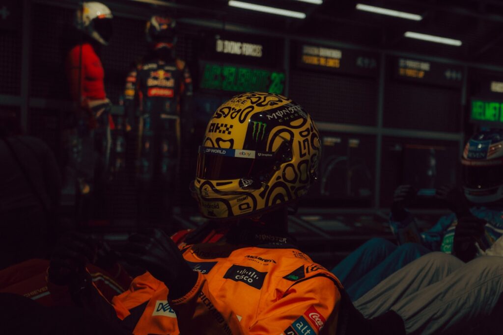 Yellow racing helmet with black doodles and white designs